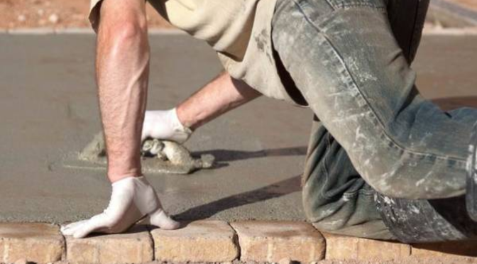 Professional concrete driveway builders installing a durable residential concrete driveway in Sydney with a smooth, long-lasting finish by PCA Concrete & Landscaping Services.